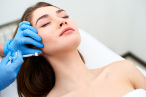 Woman relaxing while getting dermal filler injections in Livermore, CA
