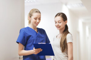 Teen girl talking with doctor after medical weight loss in Livermore, CA